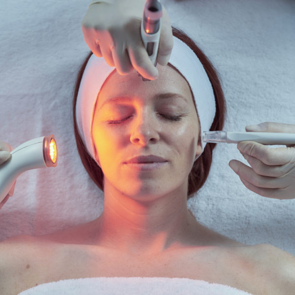 A lady receiving the DermaFrac treatment