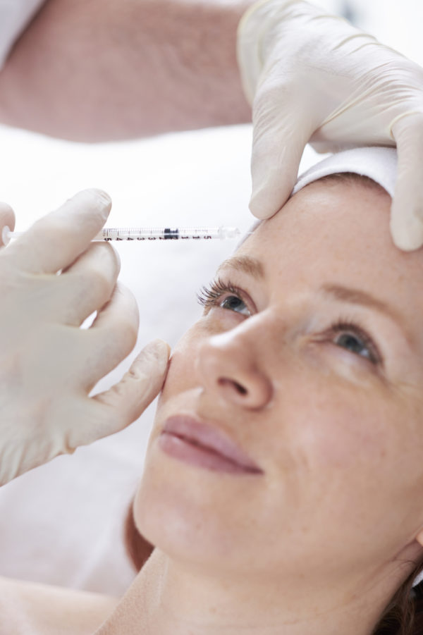 A lady receiving a botox injection