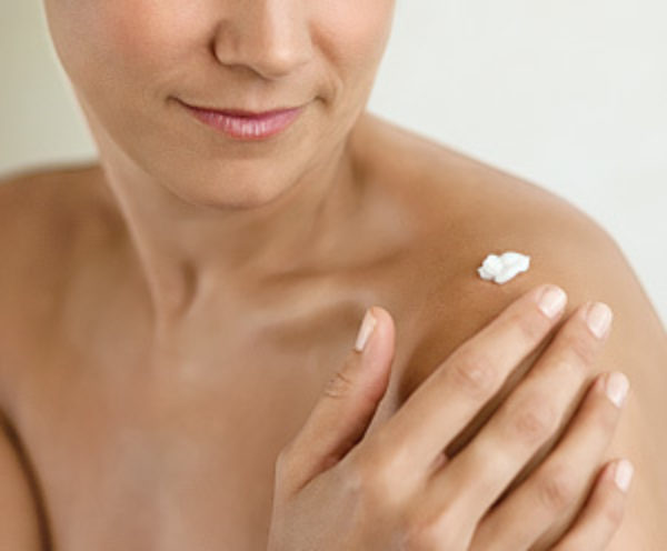 A lady applying cream